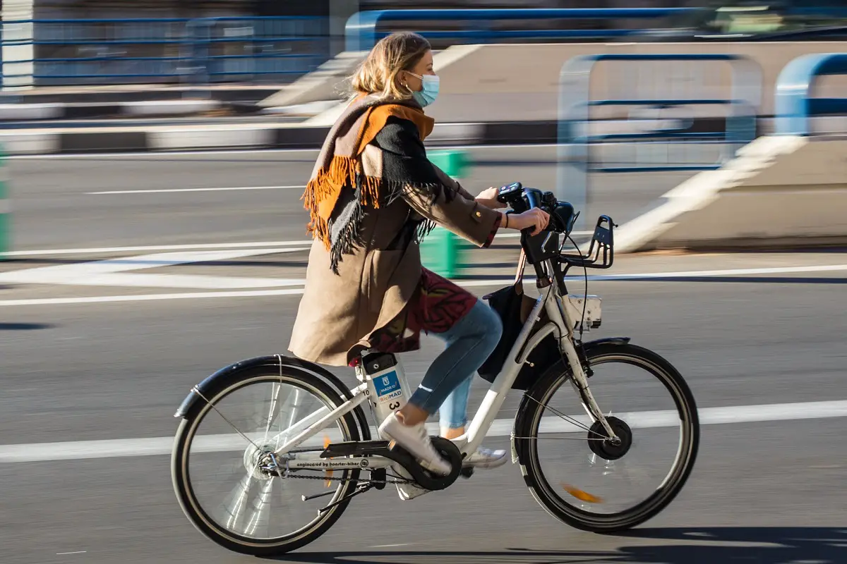 woman riding an electric bike on the road